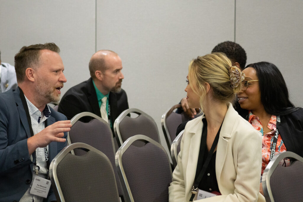 people in chairs talking and engaged